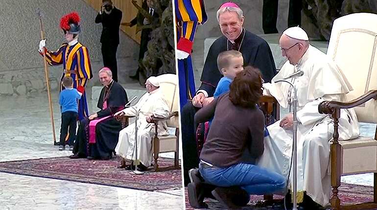 Pope chuckles as small mute boy tugs on Swiss guard sleeve during audience