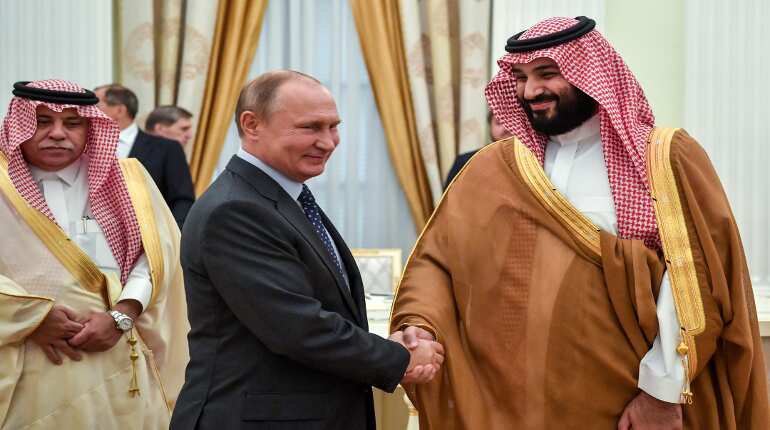 Saudi prince back on stage to Putin delight, Macron warning