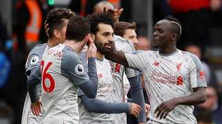 Superb Salah treble at Bournemouth sends Liverpool top