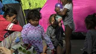 Migrant parents separated from children return to US, plead to be reunited