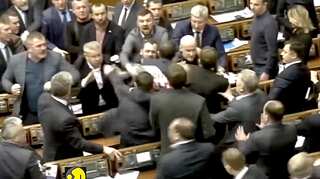 Watch: Ukrainian MPs scuffle in parliament over putin's agent poster