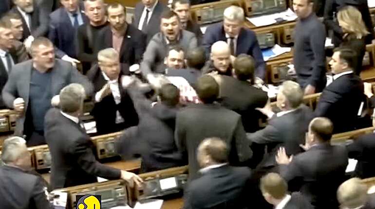 Watch: Ukrainian MPs scuffle in parliament over putin's agent poster