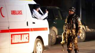 Gunmen kill at least 28 in raid on Afghan government building