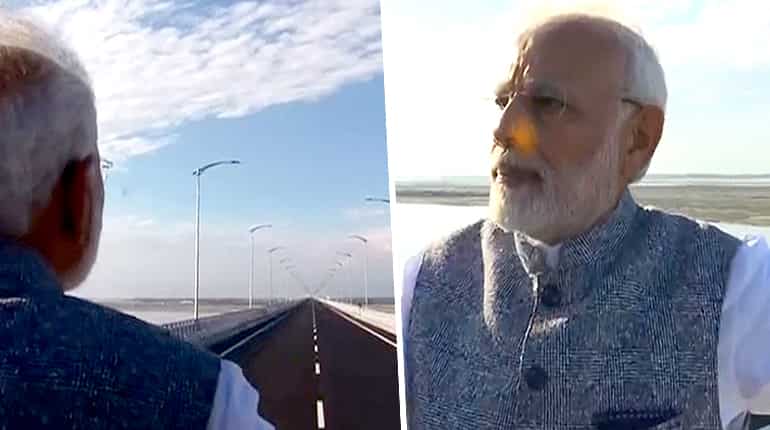 Watch: PM Modi takes a walk, rides on Bogibeel bridge in Assam Watch: PM Modi takes a walk, rides on Bogibeel bridge in Assam
