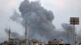 Syrian monitor says insurgents quit enclave, state media denies it