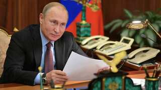 Putin, faced with ratings slump, offers Russians financial sweeteners