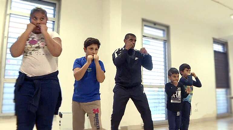 Near-blind ex-boxer puts troubled kids on right path
