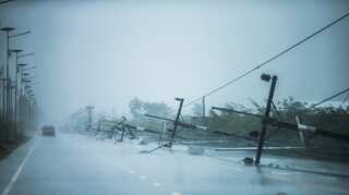 Thailand resumes flights, ferry services as tropical storm slows