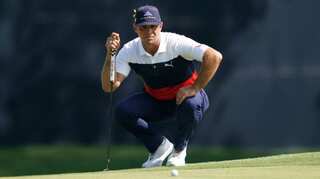 Woodland maintains lead, McIlroy in pursuit in Hawaii