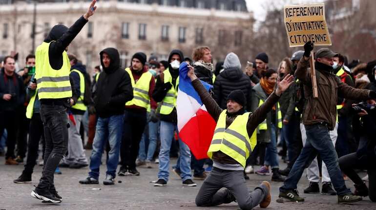 Clashes erupt as France's 'yellow vests' stage fresh protests