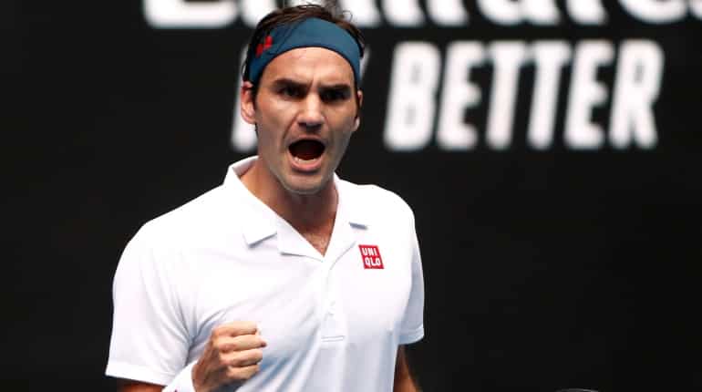 Federer made to work hard by Evans but progresses