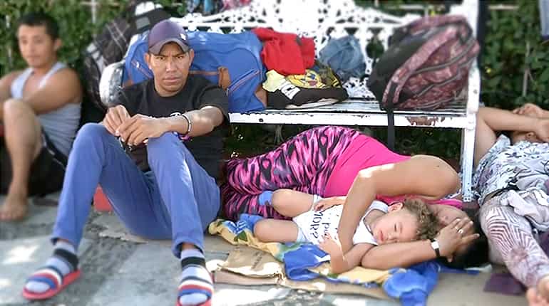 Exhausted migrants sleep in Mexican park en route to US border