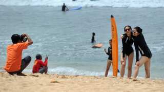 Two influencers ordered off Bali after fake mask video prank