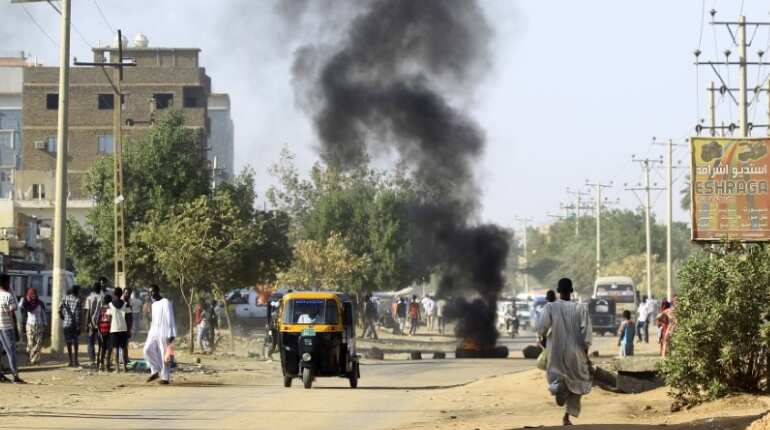 One killed as thousands protest across Sudan demanding president's resignation