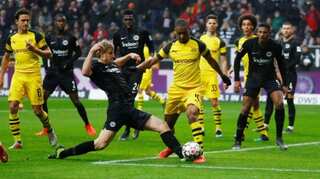 Dortmund draw at Frankfurt but increase lead at top