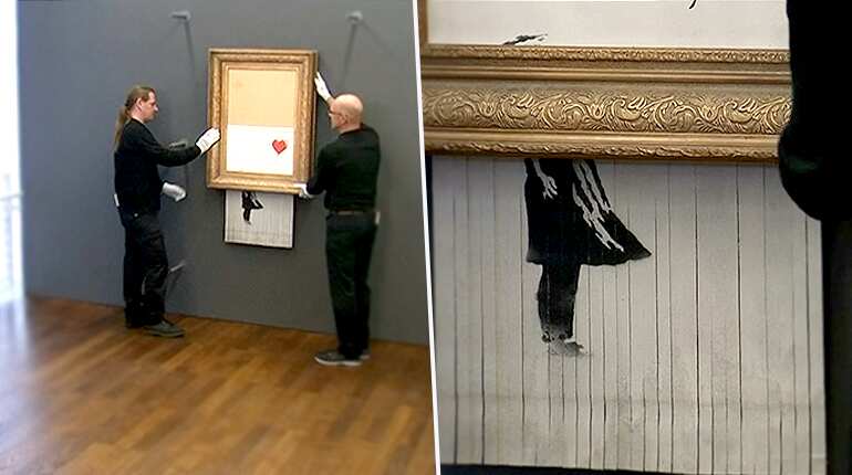 Banksy's half-destroyed painting is back on the wall