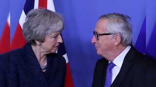 May, EU's Juncker agree to more talks to try and avoid no-deal Brexit