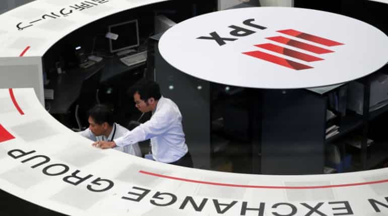 Asian shares near seven-month highs, investors pause for breath