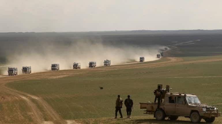 Trucks prepare to evacuate last civilians from Syrian IS enclave: SDF source