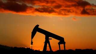 Oil prices rise on OPEC output cuts, as US sanctions bite