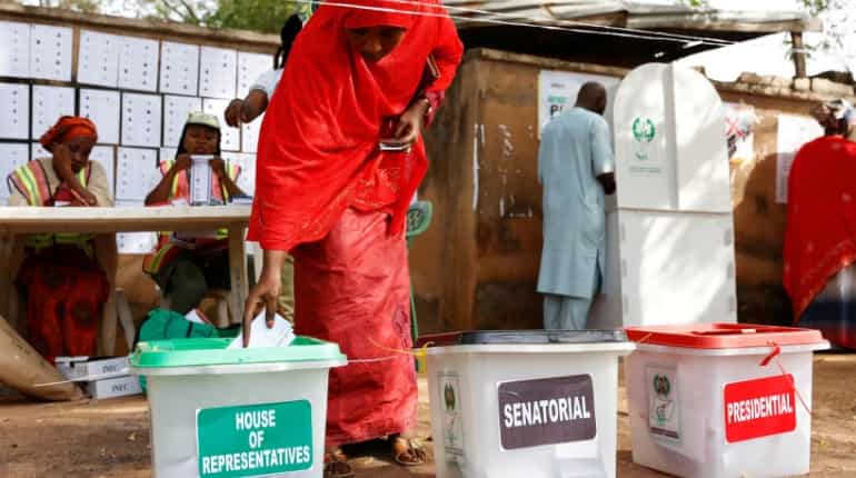 Nigerians await winner of presidential vote after polling problems