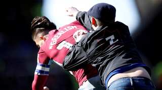 Pitch invasions raise fears for player safety