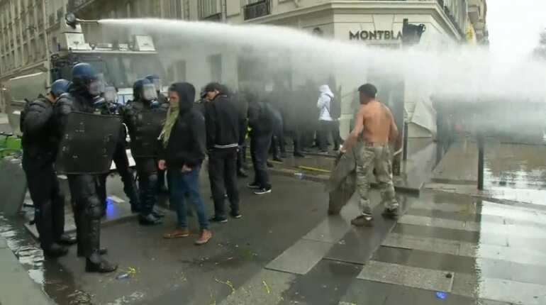 French police use water cannon on Paris protesters