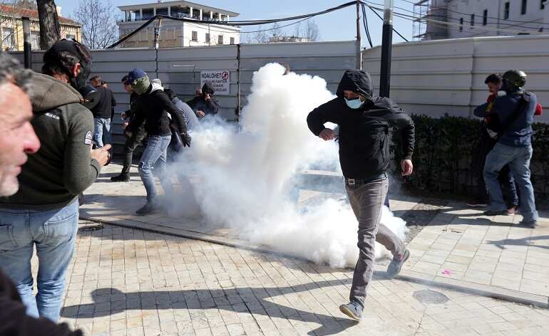 Albanian police fire tear gas at protesters calling for snap elections