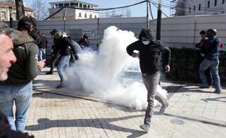 Albanian police fire tear gas at protesters calling for snap elections