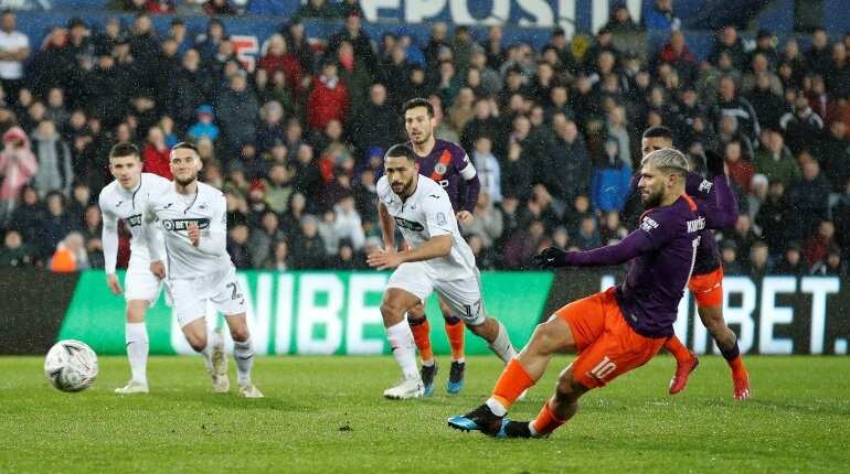 Premier League: Manchester City fight back to keep quadruple bid alive