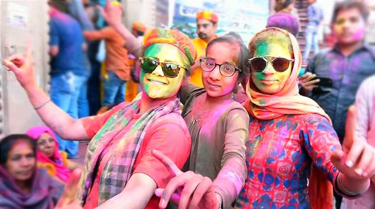 Holi celebrations begin in India with sweets and colours