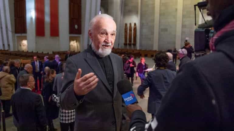 Priest stabbed live on TV at Canada's biggest church