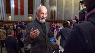 Priest stabbed live on TV at Canada's biggest church