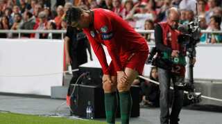 Injured Cristiano Ronaldo limps off in Portugal qualifier