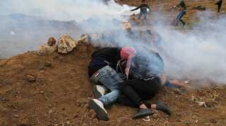 Clashes erupt at Israel-Gaza border as thousands of Palestinians mark anniversary of weekly protests