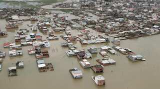 Iran evacuates flood-threatened villages after heavy rains kill dozens