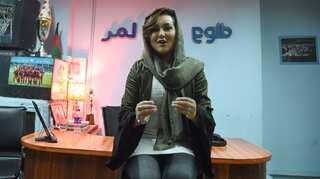 First woman to win 'Afghan Star' TV show to fight Taliban with music