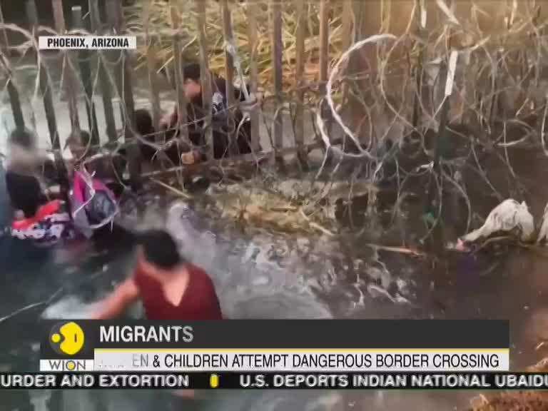 Mexicans tries to emigrate to US by crossing under the border fence