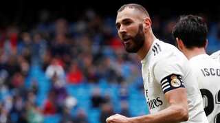 Real Madrid dig deep to beat Granada and move closer to title