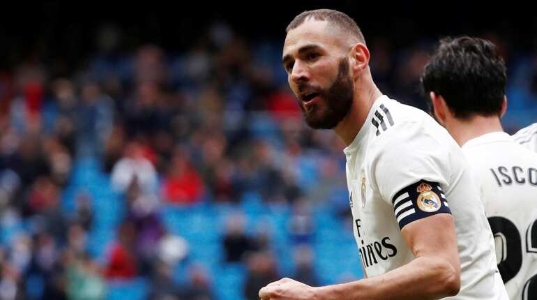 Real Madrid dig deep to beat Granada and move closer to title