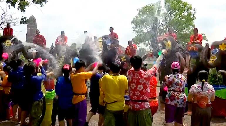 Water fight between elephants and people marks Thai New Year