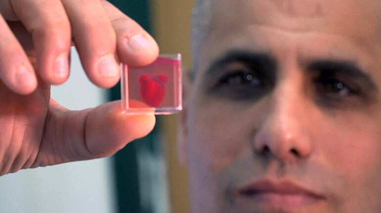 Scientists unveil 'first' 3D printed heart with human tissue