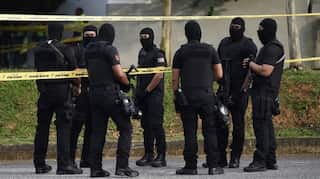 Malaysian inquiry probes trafficking camps, migrant graves