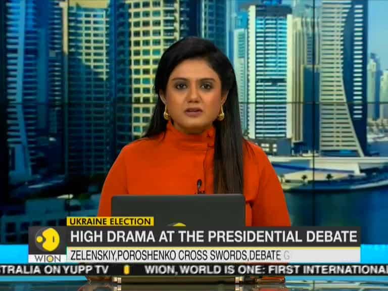 Ukraine's presidential candidates trade insults in rowdy stadium debate
