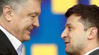 Ukrainian presidential candidates trade insults in rowdy stadium debate