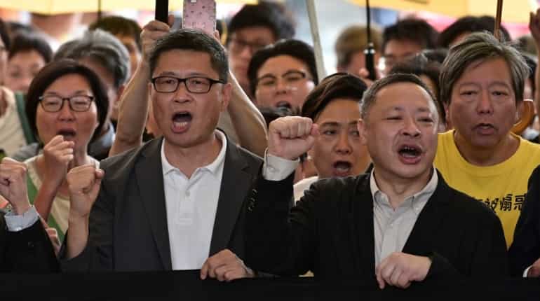 Hong Kong democracy leaders jailed over Umbrella Movement protests Hong Kong democracy leaders jailed over Umbrella Movement protests