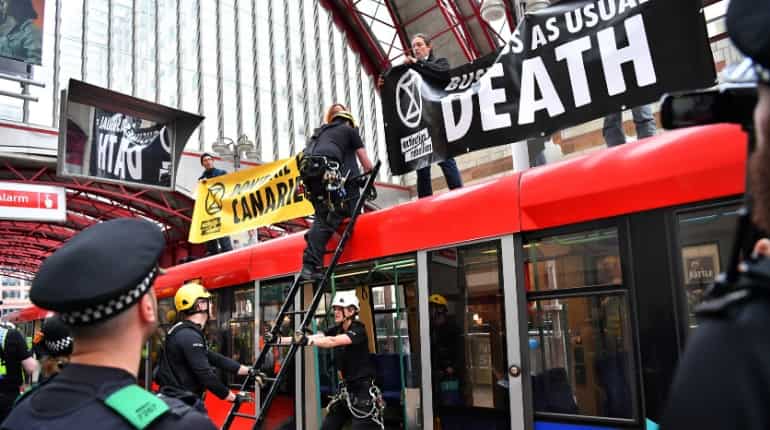 Climate change protesters target London Stock Exchange, Canary Wharf Climate change protesters target London Stock Exchange, Canary Wharf