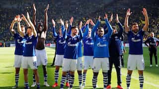 Dortmund's title hopes dented by shock home loss to Schalke