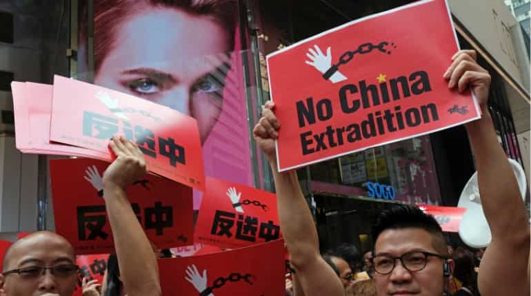 Thousands take to Hong Kong streets to protest new extradition laws