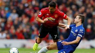 Chelsea draw at Manchester United to boost top-four chances